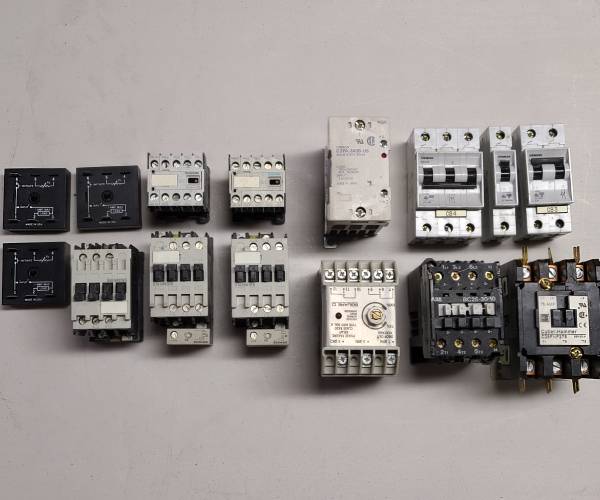 Assortment of Akrion Systems Spare Parts 5, including circuit boards and mechanical components